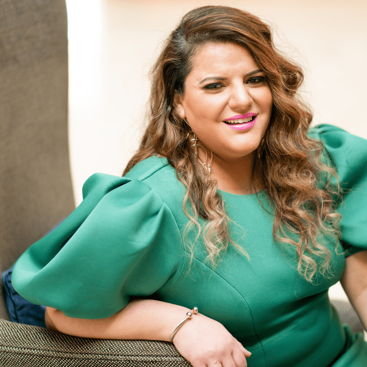 Dr. Dia Smiley seated in a green dress